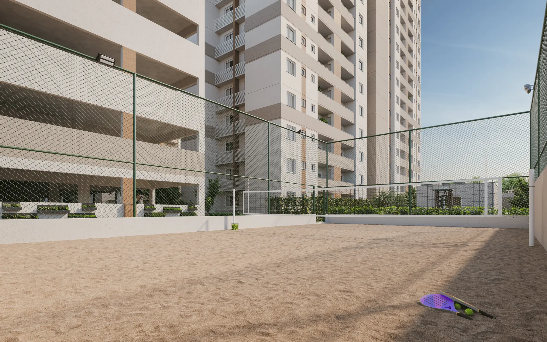 Quadra de beach tennis com areia ao lado das torres