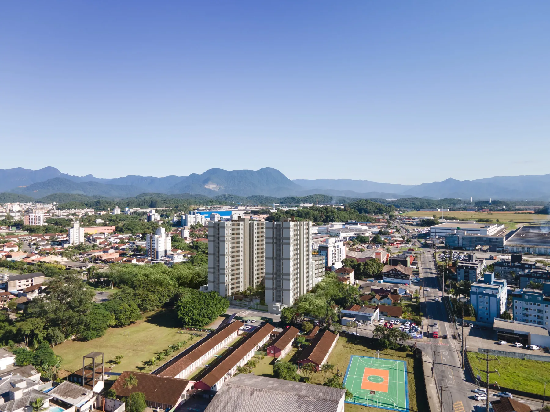 Vista aérea do bairro Santo Antônio com as torres e as montanhas ao fundo