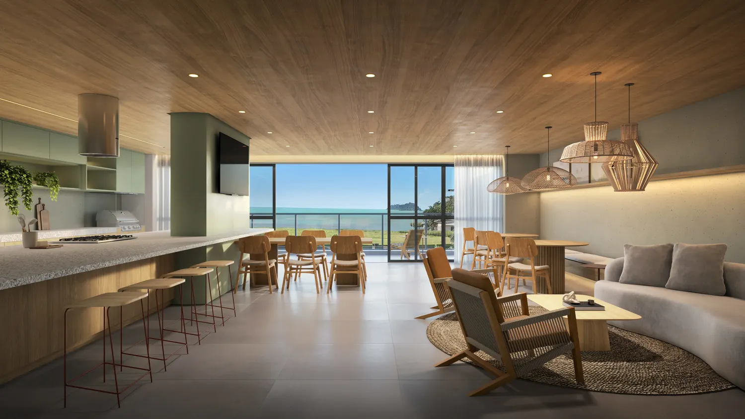 Salão gourmet com bancada, mesas e vista para o mar