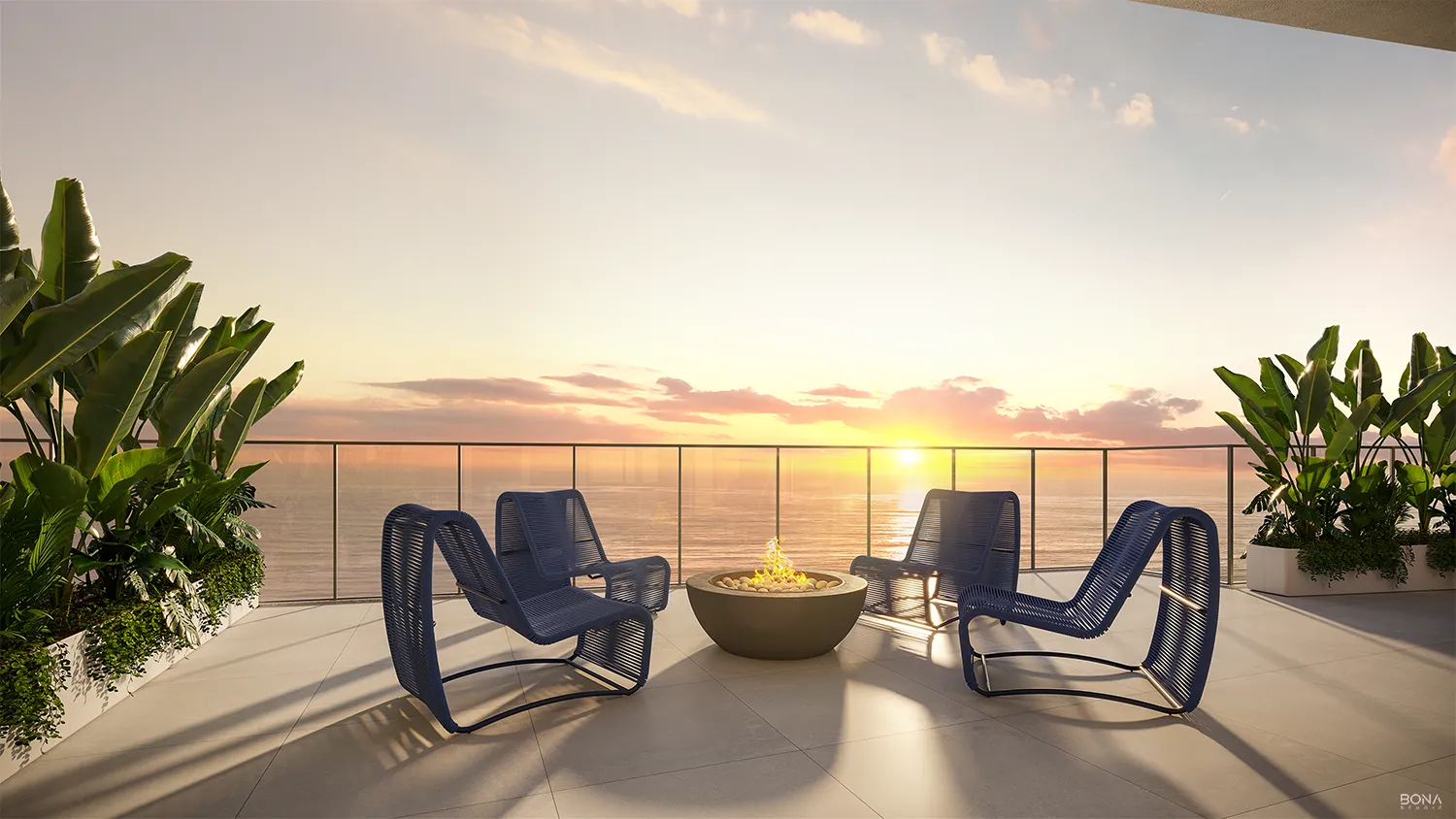 Lounge externo com poltronas e lareira ao pôr do sol