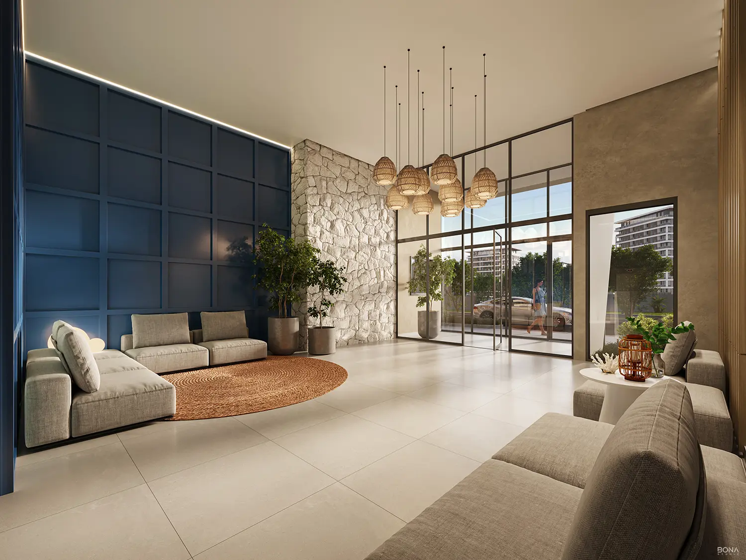 Lounge de convivência com sofás e luminárias suspensas